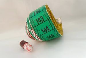 pill and green measurement 